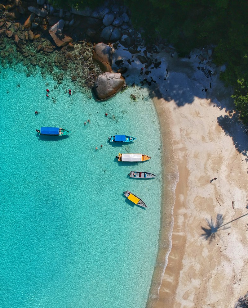 Turquoise beach holiday destination with boats